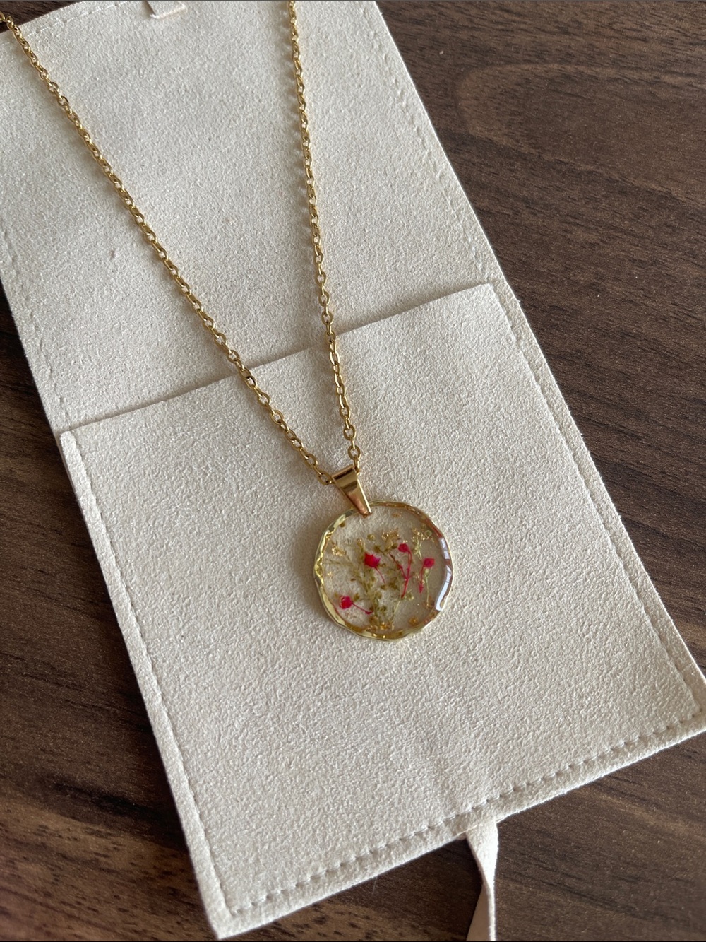 Gold Resin Pendant Necklace with Red Floral Accents